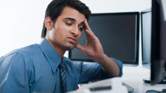 Businessman suffering from a headache